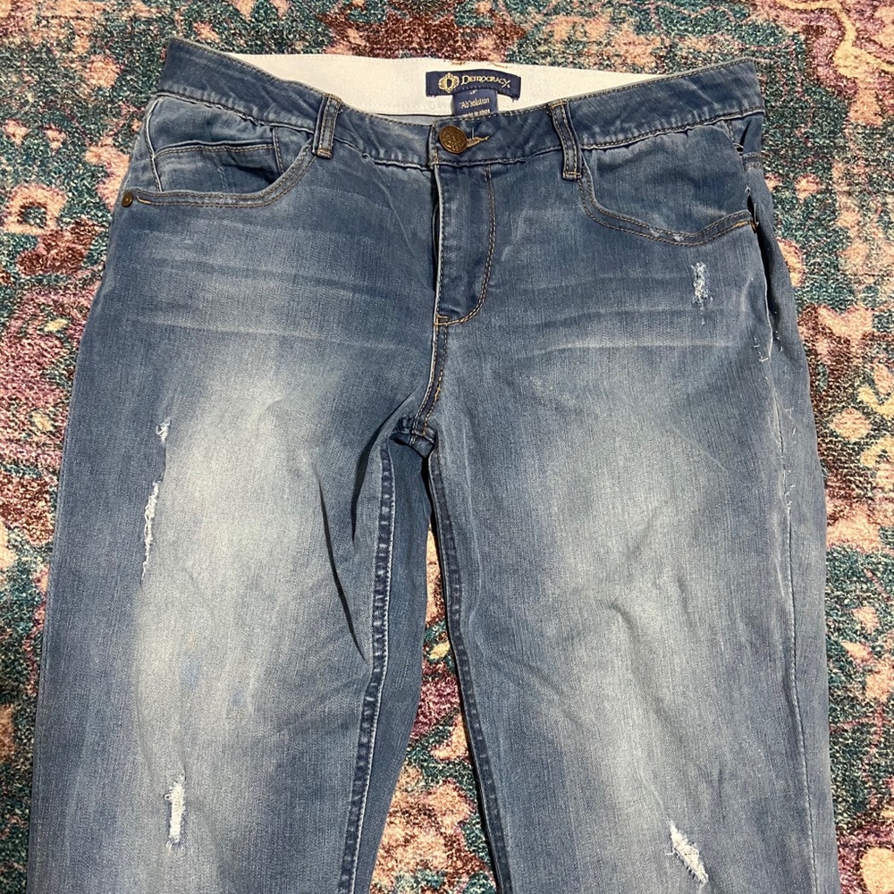 Slightly ripped stretchy blue jeans